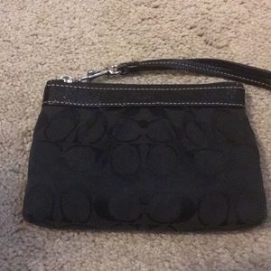 Classic black COACH wristlet